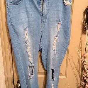Fashion Nova say less to distressed jeans in light blue wash 2x